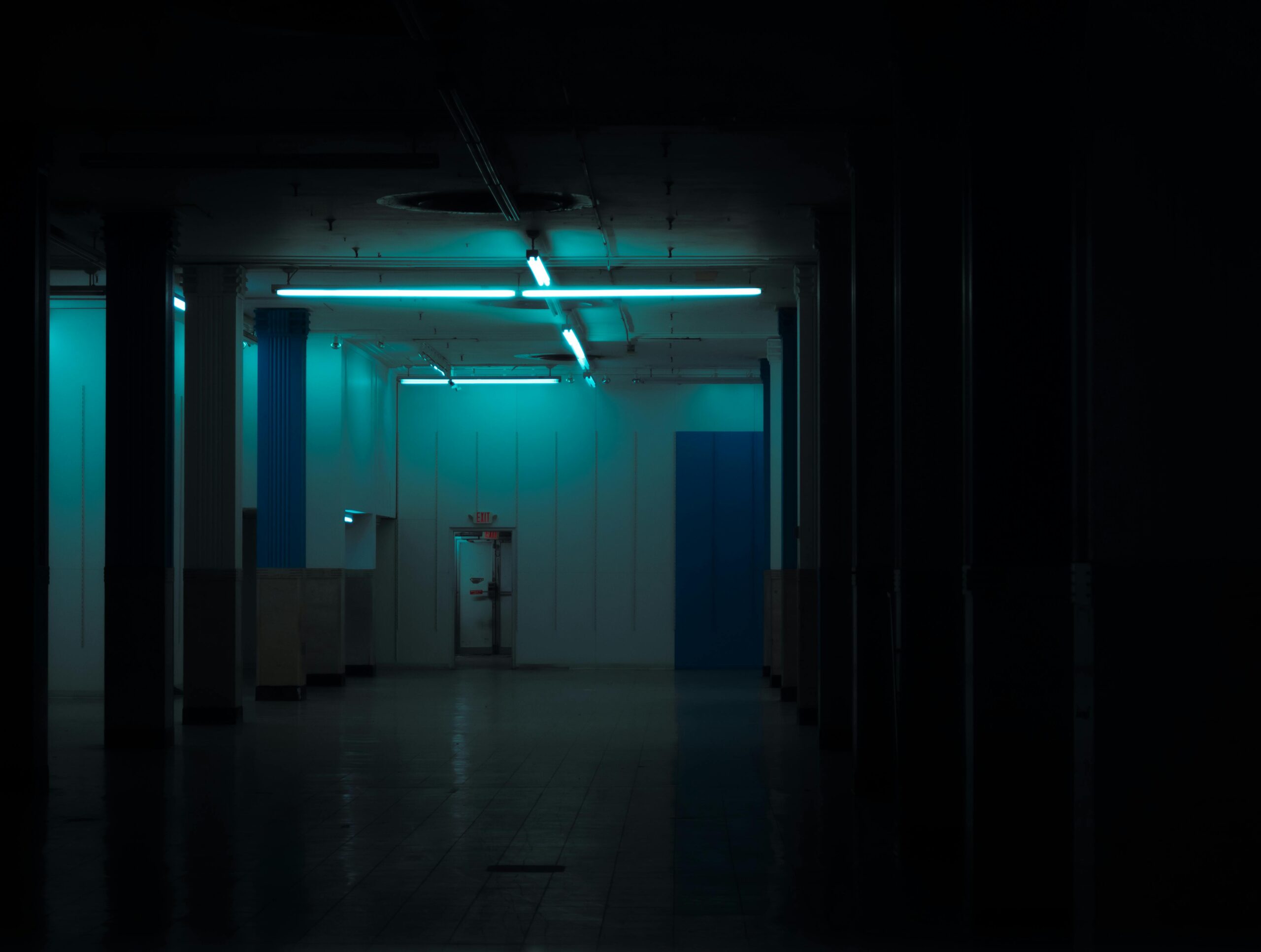 Shadowy abandoned room with a camera in the foreground, evoking a viral TikTok found-footage horror aesthetic.